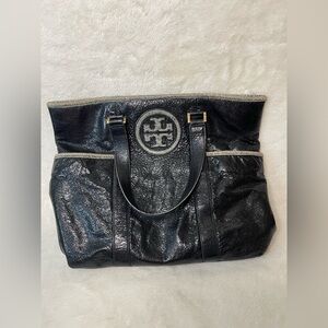 Tory Burch black tote bag with python trim and logo accents.